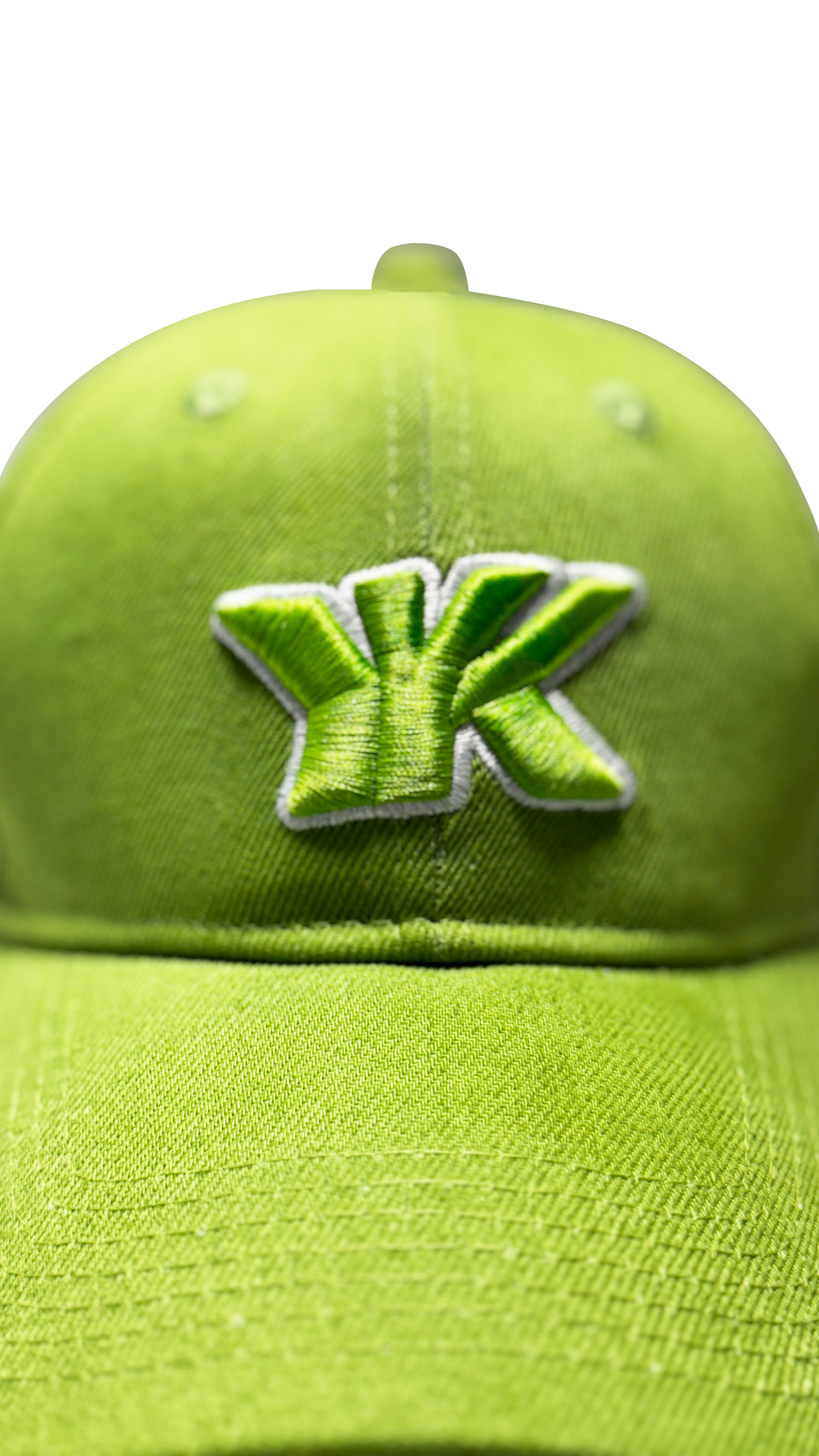 Forest green baseball cap embroidered logo close-up premium stitching