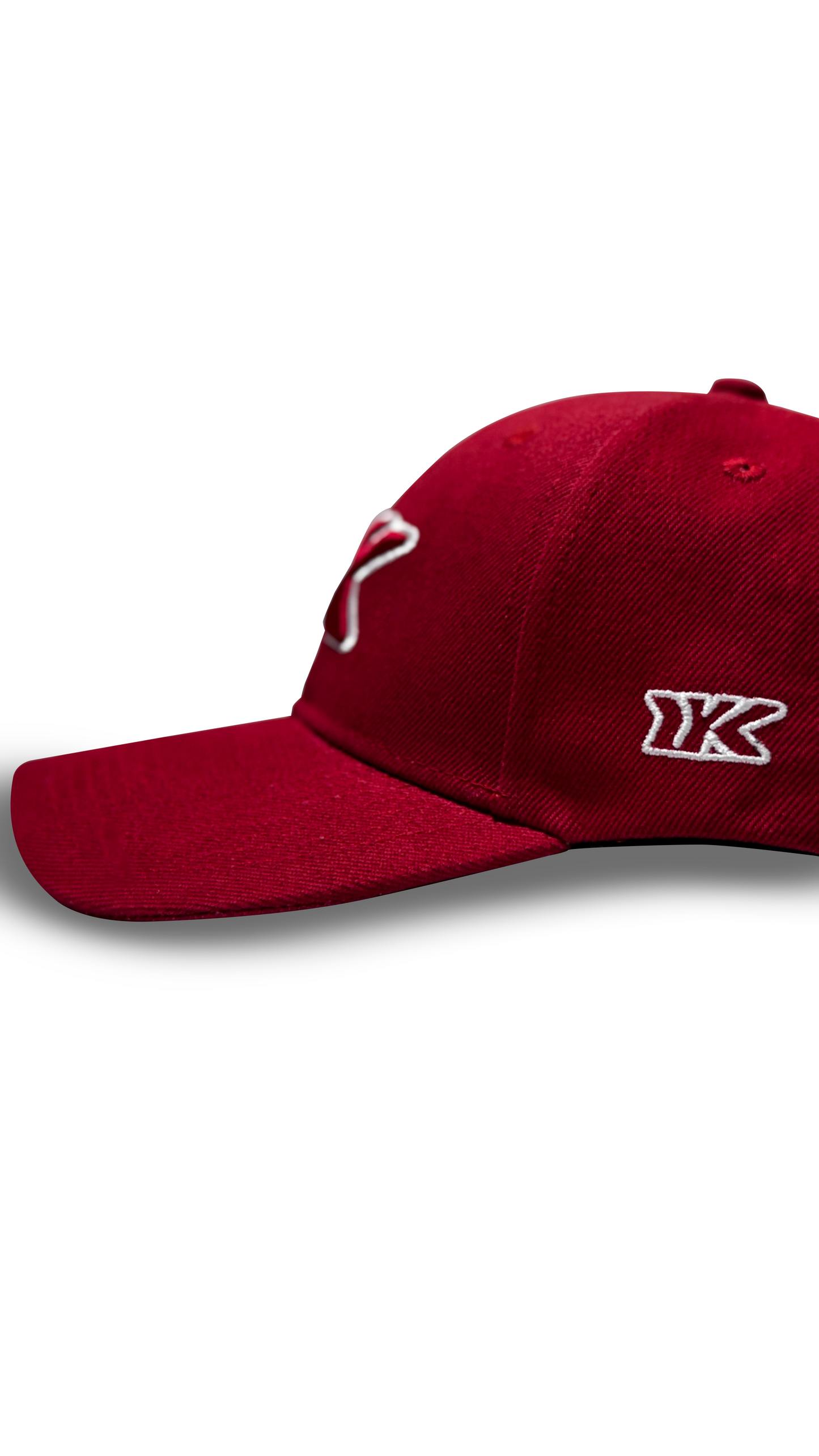 Cherry red baseball cap side profile curved brim RR Caps